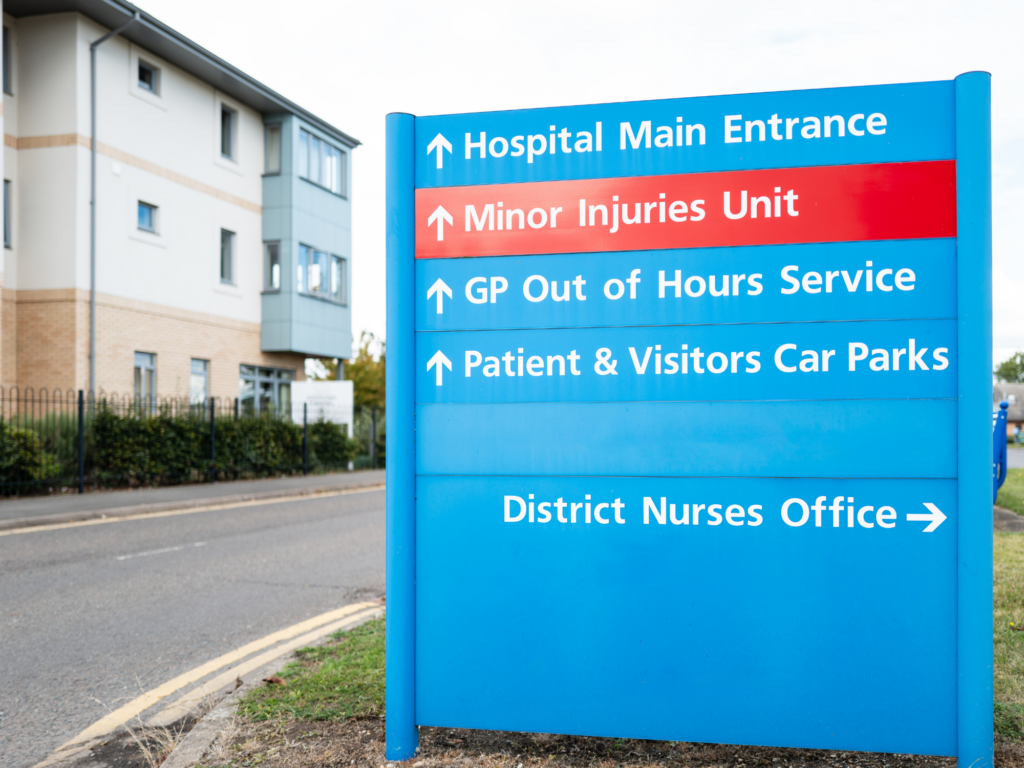 A signboard is pictured for a multi-site NHS Trust